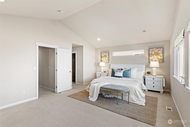 carpeted bedroom featuring lofted ceiling