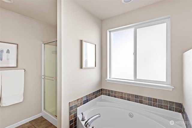 bathroom featuring tile patterned flooring and separate shower and tub