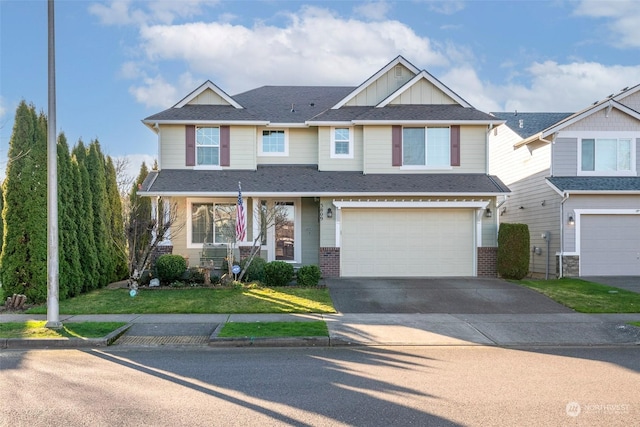 view of front of property featuring a garage and a front yard