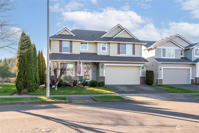 view of front of home featuring a garage and a front lawn