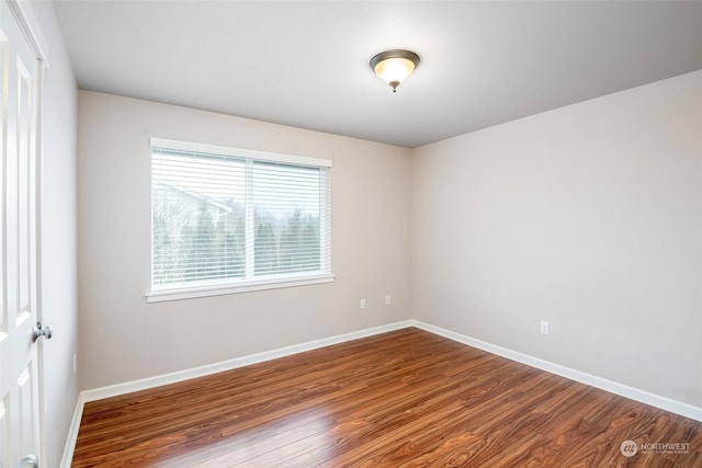 spare room featuring hardwood / wood-style floors