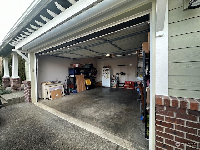 garage featuring fridge