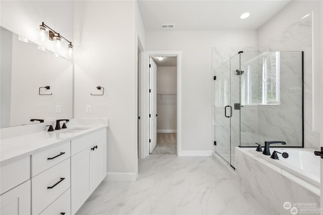 bathroom with independent shower and bath and vanity