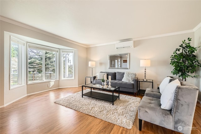 living room with ornamental molding, wood-type flooring, and a wall mounted air conditioner