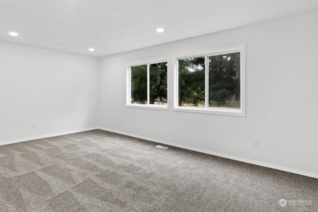 spare room featuring carpet