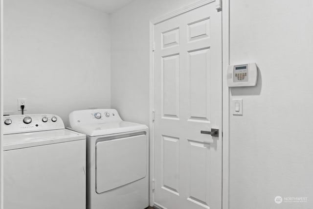 laundry area with washing machine and clothes dryer