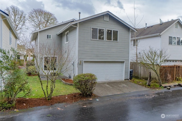 view of front of property with a garage and a front yard