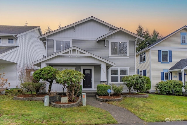 view of front of property with a yard