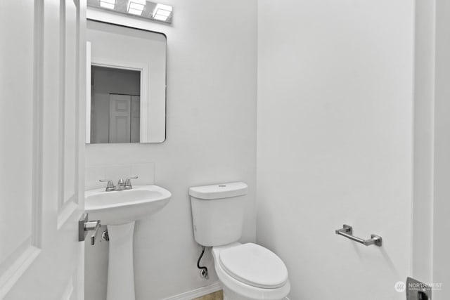 bathroom with sink and toilet