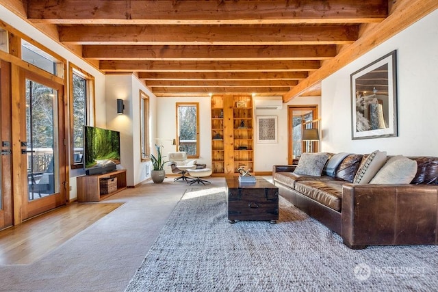 living room with a wall mounted air conditioner, beam ceiling, and carpet floors