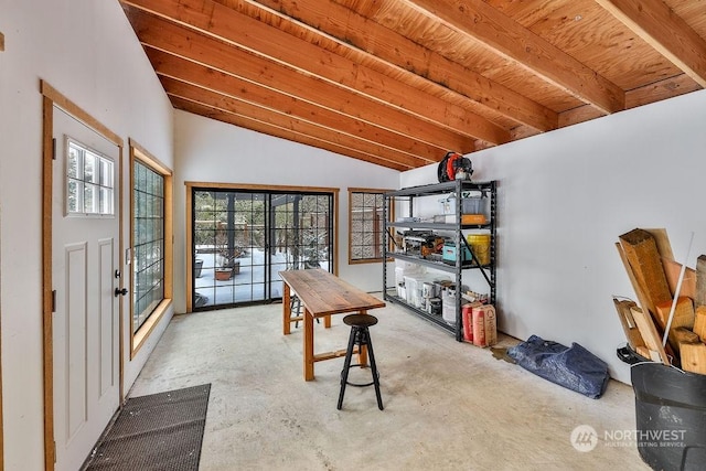 interior space with vaulted ceiling, concrete floors, and wood ceiling