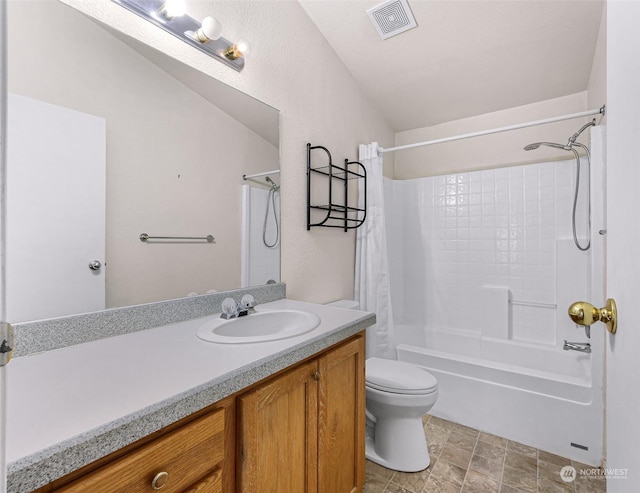 full bathroom featuring vanity, shower / washtub combination, and toilet