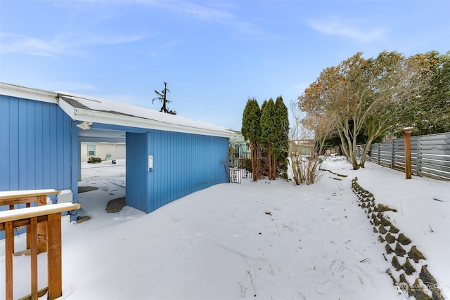 view of yard layered in snow