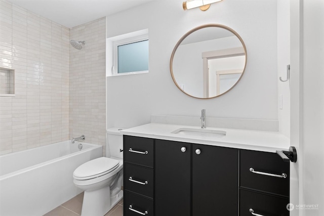 full bathroom with vanity, tiled shower / bath, tile patterned flooring, and toilet