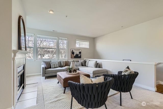 carpeted living room with a fireplace