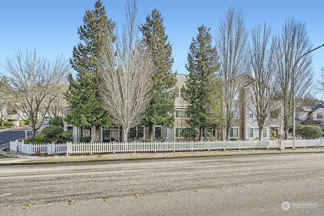 view of property hidden behind natural elements