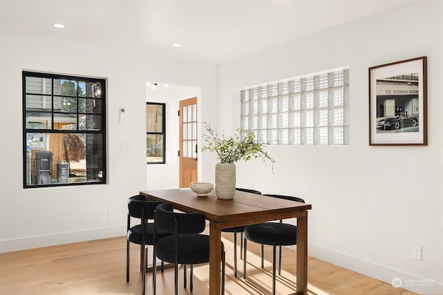 dining space featuring light hardwood / wood-style floors