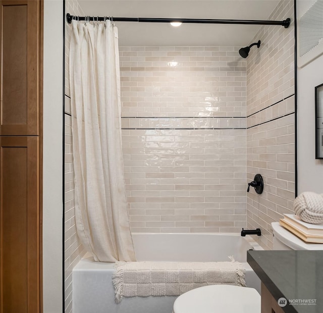 full bathroom featuring vanity, shower / bathtub combination with curtain, and toilet