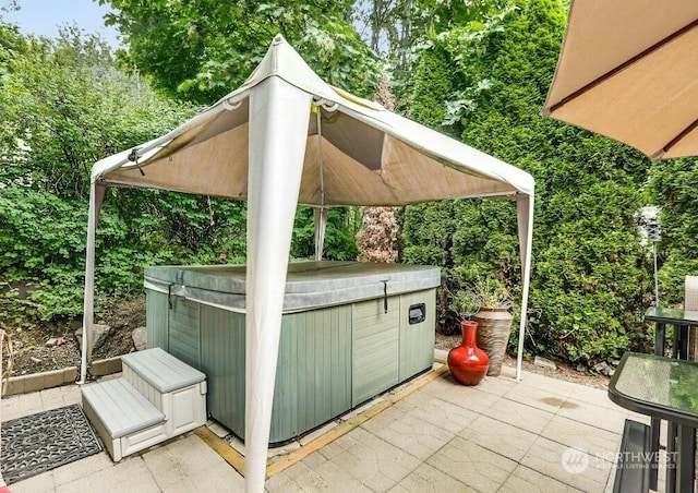 view of patio / terrace featuring a hot tub