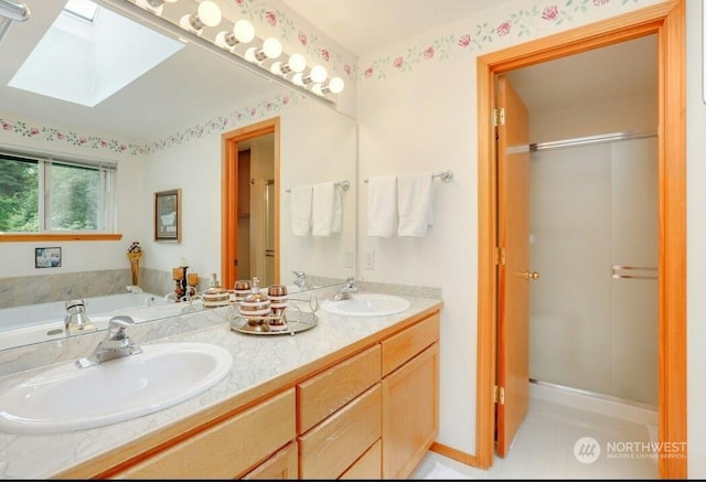 bathroom featuring vanity, a skylight, and independent shower and bath