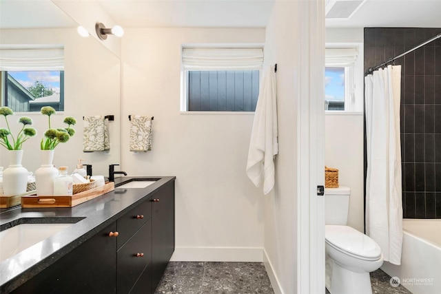 full bathroom with vanity, toilet, and shower / bath combo with shower curtain