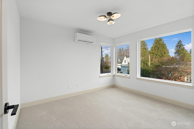 unfurnished room featuring a wall mounted AC and carpet