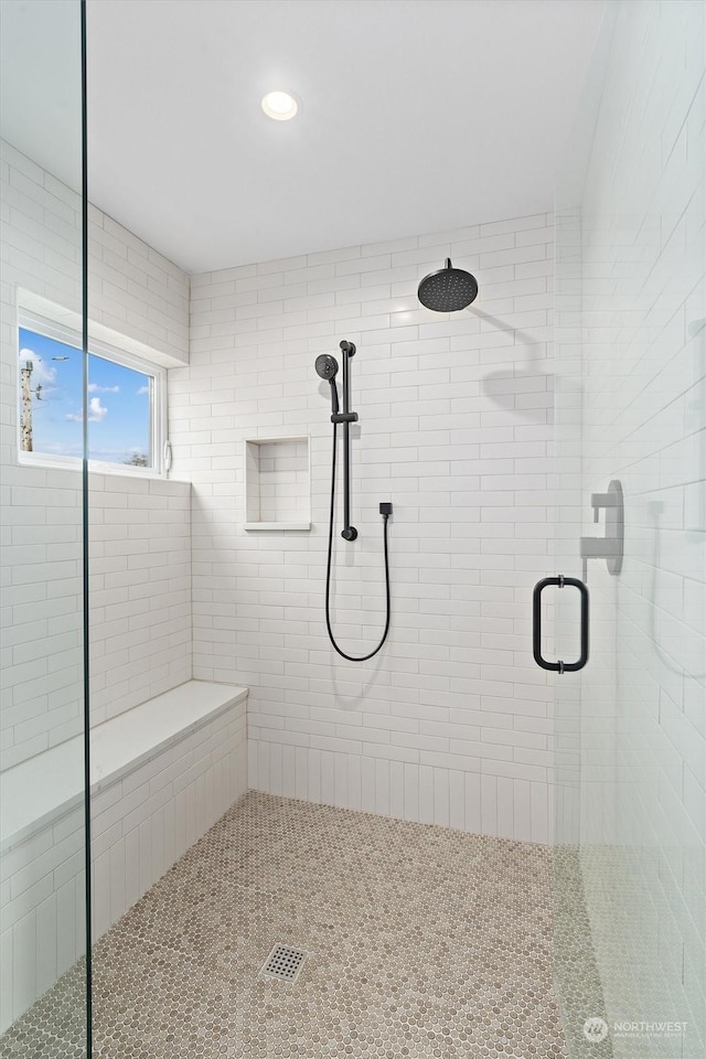 bathroom featuring an enclosed shower