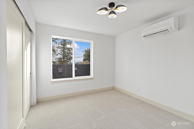 unfurnished room with light carpet and a wall mounted air conditioner