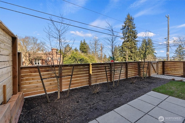 view of yard featuring a gate and fence