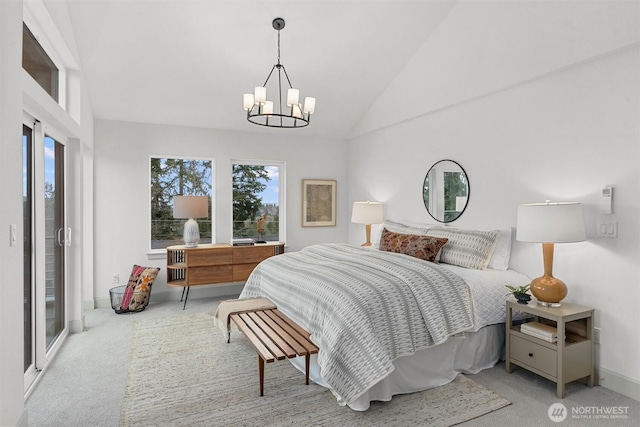 bedroom with carpet floors, a chandelier, multiple windows, and vaulted ceiling