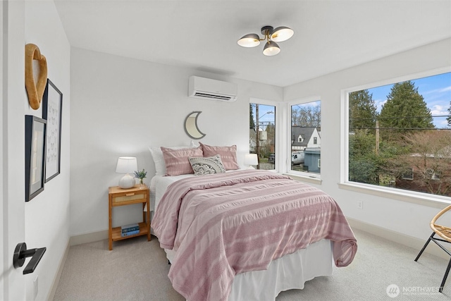 carpeted bedroom featuring a wall unit AC and baseboards