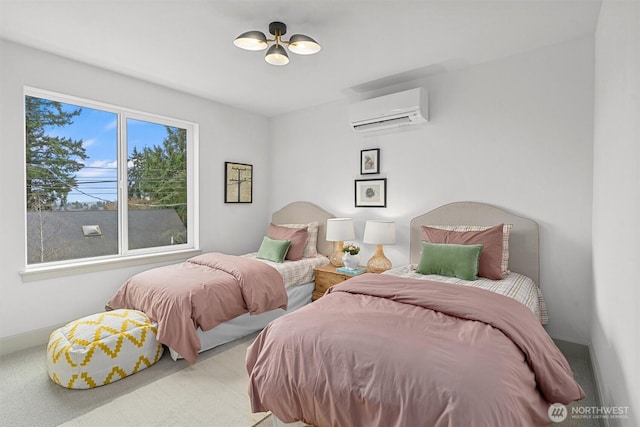 bedroom featuring a wall mounted AC and baseboards