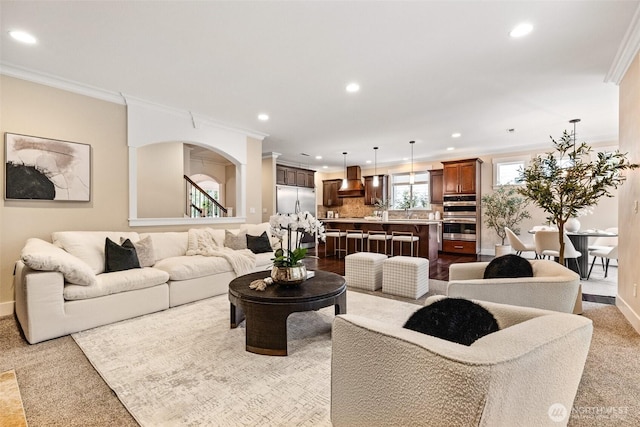 living room featuring ornamental molding, recessed lighting, and baseboards