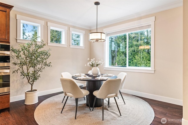 dining room featuring a wealth of natural light, baseboards, ornamental molding, and dark wood-style flooring