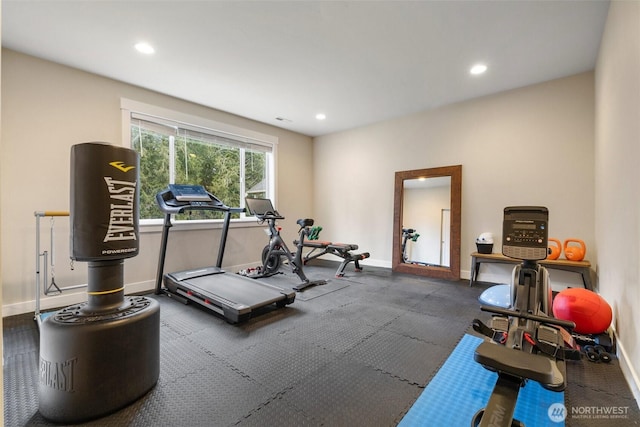 exercise room with baseboards and recessed lighting