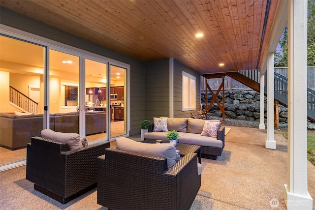 view of patio / terrace featuring stairs and an outdoor hangout area