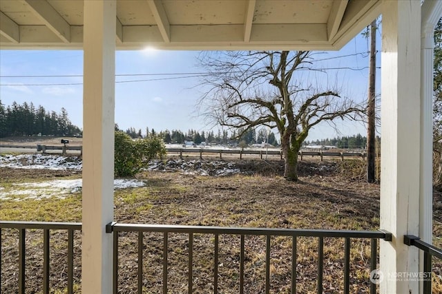 view of yard with a rural view