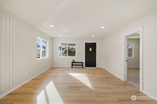 spare room with light hardwood / wood-style flooring