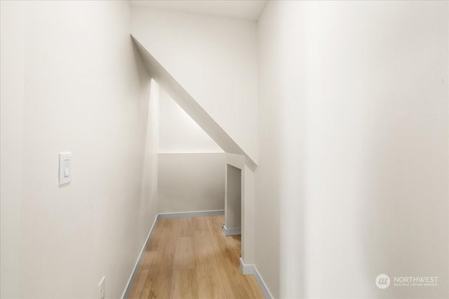 hallway with light hardwood / wood-style flooring