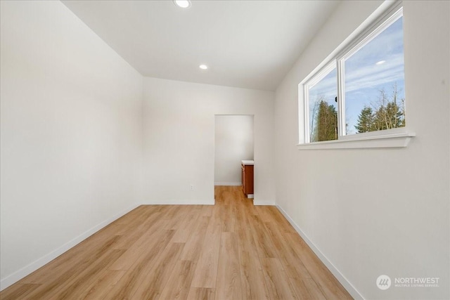 spare room featuring light wood-type flooring