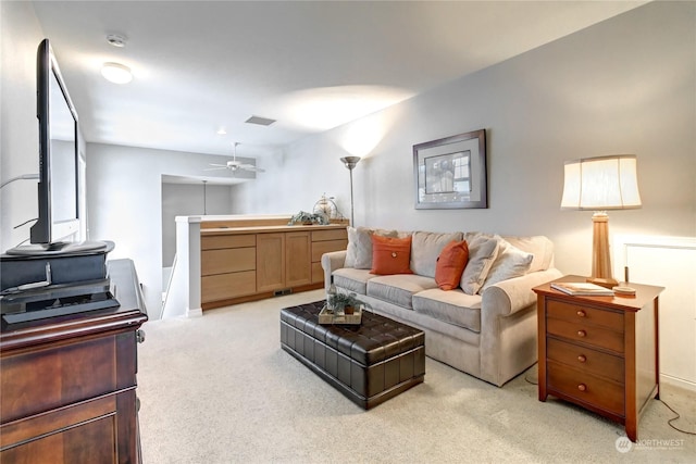 living room with light carpet and ceiling fan