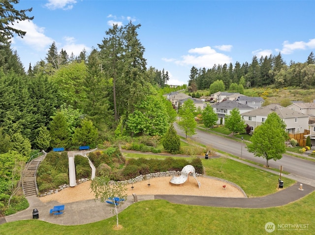 view of property's community with a yard and a residential view