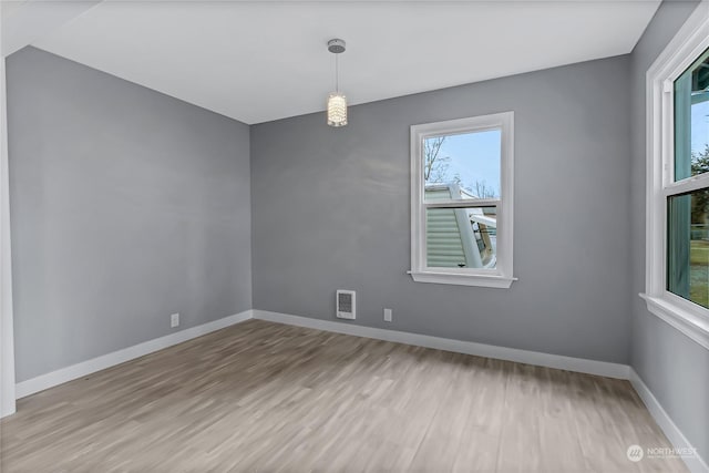 unfurnished room featuring light hardwood / wood-style flooring