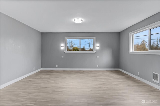 unfurnished room featuring light wood-type flooring