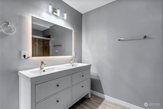 bathroom featuring vanity and hardwood / wood-style flooring
