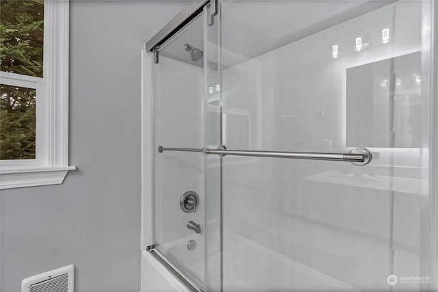 bathroom featuring enclosed tub / shower combo