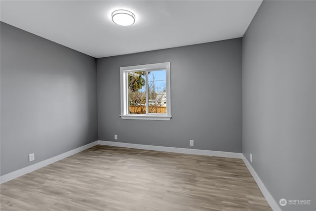 spare room with light wood-type flooring