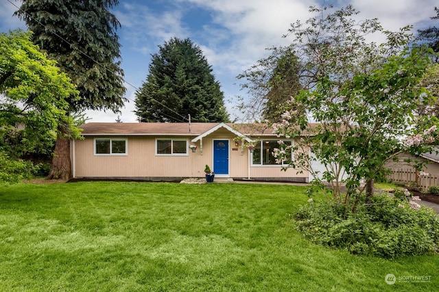 ranch-style home with a front lawn