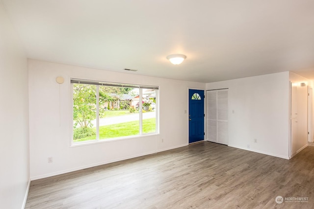 spare room featuring hardwood / wood-style flooring