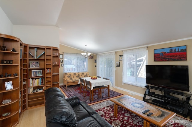 living room featuring lofted ceiling, a notable chandelier, and light wood-type flooring